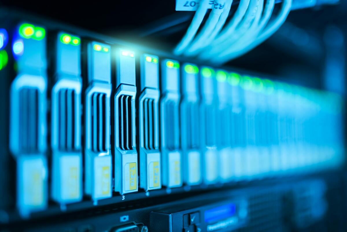 A server rack with glowing lights in a modern data center
